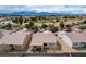 Expansive aerial shot of a residential community with mountain views and a golf course at 7460 Chaffinch St, North Las Vegas, NV 89084
