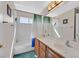 Bathroom featuring double sinks with chrome faucets and white cabinets beneath at 8208 Flowing Rapids Ct, Las Vegas, NV 89131