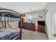 Bedroom featuring a bunk bed, a window with plantation shutters, and a brown dresser at 8208 Flowing Rapids Ct, Las Vegas, NV 89131
