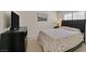 This bedroom features a black headboard and a TV atop a dark dresser at 8208 Flowing Rapids Ct, Las Vegas, NV 89131