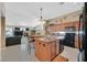 Open kitchen featuring granite countertops, stainless steel appliances, and an island with bar seating at 8208 Flowing Rapids Ct, Las Vegas, NV 89131