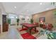 Open living room featuring a pool table, tile floors, neutral walls, and comfortable seating arrangements at 8208 Flowing Rapids Ct, Las Vegas, NV 89131