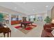 Spacious living area with tile floors, pool table, and views into an adjacent kitchen, perfect for entertaining at 8208 Flowing Rapids Ct, Las Vegas, NV 89131