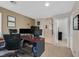 Spacious office area with desk, carpet flooring, and views into other areas of the home at 8208 Flowing Rapids Ct, Las Vegas, NV 89131