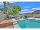 Backyard with a pool and jacuzzi, perfect for outdoor relaxation and entertainment at 8208 Flowing Rapids Ct, Las Vegas, NV 89131
