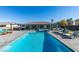 Inviting backyard with a sparkling pool, lounge chairs and outdoor dining at 8637 Home Gate Ct, Las Vegas, NV 89113