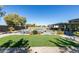 Beautiful backyard with a pool, manicured artificial turf, and a spacious outdoor dining and kitchen area at 8637 Home Gate Ct, Las Vegas, NV 89113