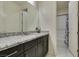 Bright bathroom featuring granite countertops, undermount sink, and shower with butterfly curtain at 8637 Home Gate Ct, Las Vegas, NV 89113
