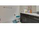 Bathroom with granite countertops, under-sink cabinets, and modern fixtures at 8637 Home Gate Ct, Las Vegas, NV 89113