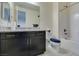 Bathroom featuring a dark vanity, granite countertop, and shower-tub combination at 8637 Home Gate Ct, Las Vegas, NV 89113