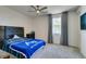 Comfortable bedroom with large window and ceiling fan at 8637 Home Gate Ct, Las Vegas, NV 89113