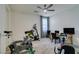 Bright bedroom with exercise equipment, desk, and ceiling fan; ideal for a home gym at 8637 Home Gate Ct, Las Vegas, NV 89113
