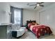 Bedroom featuring a comfortable bed and a cozy armchair at 8637 Home Gate Ct, Las Vegas, NV 89113