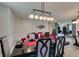 Well-lit dining area featuring a formal dining set and access to the adjacent living space at 8637 Home Gate Ct, Las Vegas, NV 89113