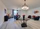 Dining room features modern chandelier, stylish decor, and a large window for natural light at 8637 Home Gate Ct, Las Vegas, NV 89113