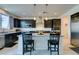 Modern kitchen featuring stainless steel appliances, granite countertops, and dark wood cabinetry at 8637 Home Gate Ct, Las Vegas, NV 89113