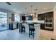 Modern kitchen features stainless steel appliances, an island, and hardwood floors at 8637 Home Gate Ct, Las Vegas, NV 89113