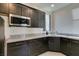 Modern kitchen with granite countertops and stainless steel appliances at 8637 Home Gate Ct, Las Vegas, NV 89113