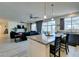 Open concept kitchen view to the living room with granite counters and stainless steel appliances at 8637 Home Gate Ct, Las Vegas, NV 89113