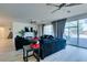 Light and airy living room with backyard access, ceiling fan, and hardwood floors at 8637 Home Gate Ct, Las Vegas, NV 89113