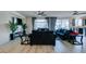 Open-concept living room boasts hardwood floors, a TV, and great lighting at 8637 Home Gate Ct, Las Vegas, NV 89113