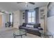 Cozy living room with a comfortable couch, table, and natural light at 8637 Home Gate Ct, Las Vegas, NV 89113