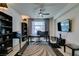 Well-appointed home office with a large desk, shelving, and a view of the outdoors at 8637 Home Gate Ct, Las Vegas, NV 89113