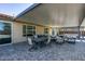 Lovely covered outdoor patio with ample seating, ideal for enjoying the outdoor spaces in comfort and style at 8637 Home Gate Ct, Las Vegas, NV 89113