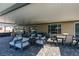 Covered outdoor patio featuring a generous lounge area and dining space, great for entertaining and relaxation at 8637 Home Gate Ct, Las Vegas, NV 89113