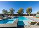 Sparkling pool and spa surrounded by lounge chairs and desert landscaping at 8637 Home Gate Ct, Las Vegas, NV 89113
