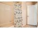 The bathroom includes a shower/tub combination with a patterned shower curtain at 9532 Calico Garden Ave, Las Vegas, NV 89134