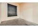 A bedroom featuring neutral carpeting and a window with horizontal blinds at 9532 Calico Garden Ave, Las Vegas, NV 89134