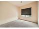 Neutral bedroom with plush carpeting and a window with a dark blind at 9532 Calico Garden Ave, Las Vegas, NV 89134