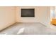 A bright bedroom featuring neutral carpeting and a window with horizontal blinds at 9532 Calico Garden Ave, Las Vegas, NV 89134