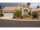 Charming single-story home with a two car garage, desert landscaping and a tile roof at 9532 Calico Garden Ave, Las Vegas, NV 89134
