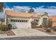 Inviting single-story home with tile roof, well-maintained landscaping, and a two-car garage at 9532 Calico Garden Ave, Las Vegas, NV 89134