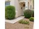Charming single-story home featuring desert landscaping, a covered porch, and a well-manicured lawn at 9532 Calico Garden Ave, Las Vegas, NV 89134