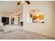 Open living room showcasing access to kitchen, fireplace, and adjacent rooms at 9532 Calico Garden Ave, Las Vegas, NV 89134