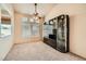 Spacious living room with carpet flooring and tall display cabinet at 9532 Calico Garden Ave, Las Vegas, NV 89134
