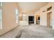 Open-concept living room with carpet, leading to the entrance and other areas of the home at 9532 Calico Garden Ave, Las Vegas, NV 89134