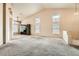 Large living room with high ceilings, lots of natural light, and neutral carpet and decor at 9532 Calico Garden Ave, Las Vegas, NV 89134