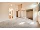 Spacious main bedroom with neutral carpet, ensuite access, and closet at 9532 Calico Garden Ave, Las Vegas, NV 89134