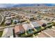 Stunning aerial view of a vibrant residential area with well-maintained homes and green spaces at 9974 Petroglyph Canyon Ave, Las Vegas, NV 89166