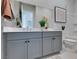 Contemporary bathroom with double vanity, framed mirror, and ample storage at 9974 Petroglyph Canyon Ave, Las Vegas, NV 89166