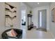 Contemporary entryway boasting a bench, coat rack, and stylish decor at 9974 Petroglyph Canyon Ave, Las Vegas, NV 89166