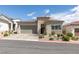 Charming single story home with a brick driveway, desert landscaping, and a two car garage at 9974 Petroglyph Canyon Ave, Las Vegas, NV 89166