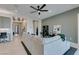 Spacious living room with an open layout, modern furnishings, and seamless flow to other living areas at 9974 Petroglyph Canyon Ave, Las Vegas, NV 89166