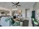 Bright living room with a comfortable sectional sofa, modern furnishings, and open layout connecting to the kitchen at 9974 Petroglyph Canyon Ave, Las Vegas, NV 89166