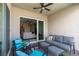 Inviting covered patio with stylish seating, perfect for outdoor relaxation and entertaining at 9974 Petroglyph Canyon Ave, Las Vegas, NV 89166