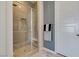 Walk-in shower with glass door, tile surround, bench, and modern fixtures adding convenience and style at 9974 Petroglyph Canyon Ave, Las Vegas, NV 89166